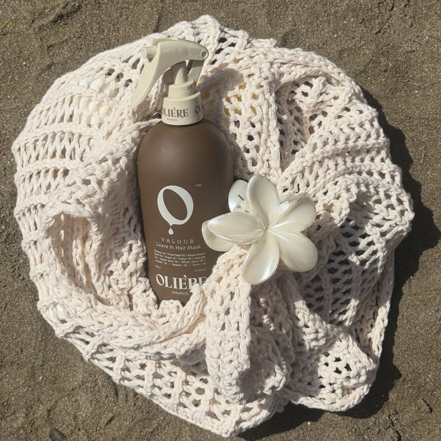 Oli&egrave;re Paris Valour Leave-In Hair Mask in a woven bag with a flower hair clip
